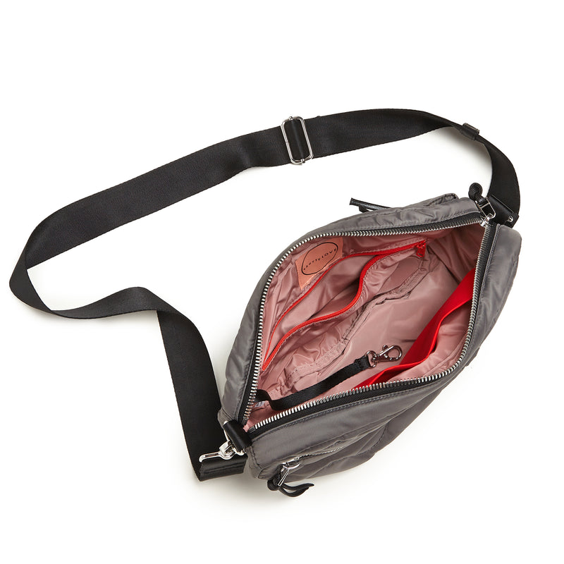 shortyLOVE cruiser medium crossbody bag in pewter; top-down view showing interior blush lining against white background.