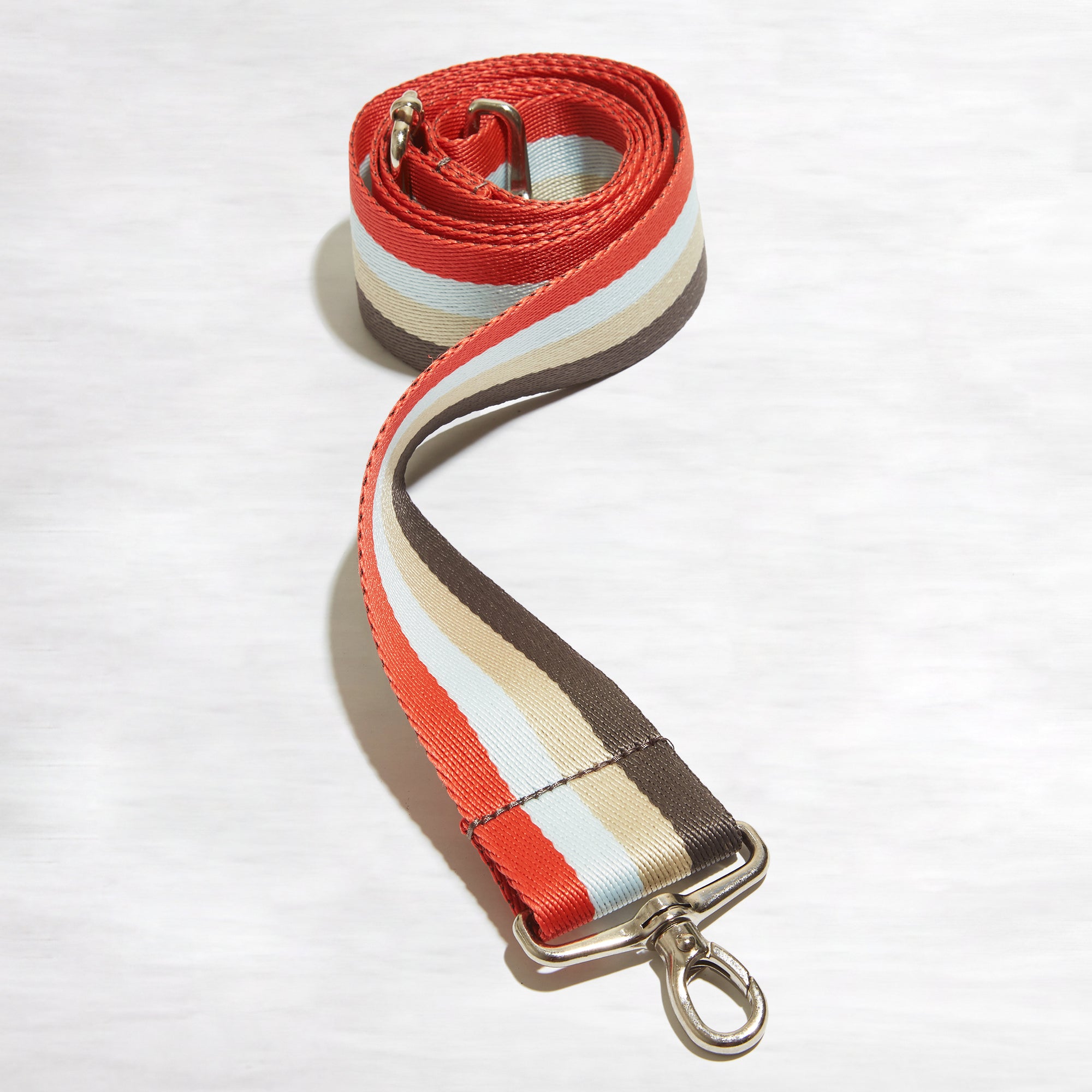 shortyLOVE boardwalk strap in mocha/khaki/blue/orange; front view rolled against white background.