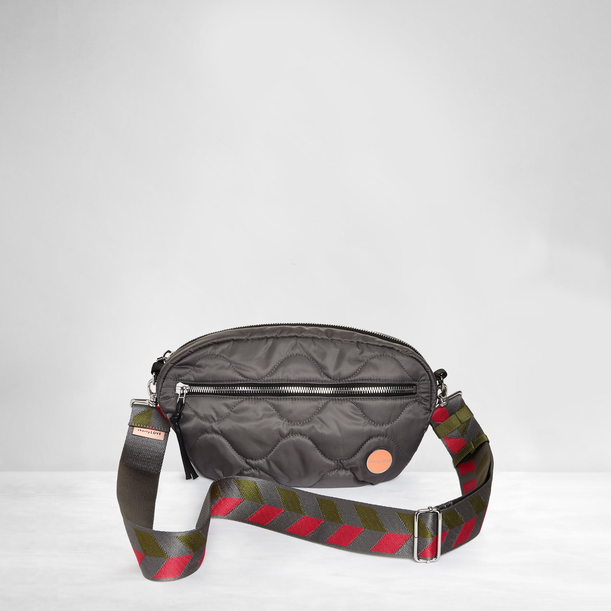 shortyLOVE boardwalk strap in arrow design in pewter/sage/magenta; shown with small cruiser bag in pewter.