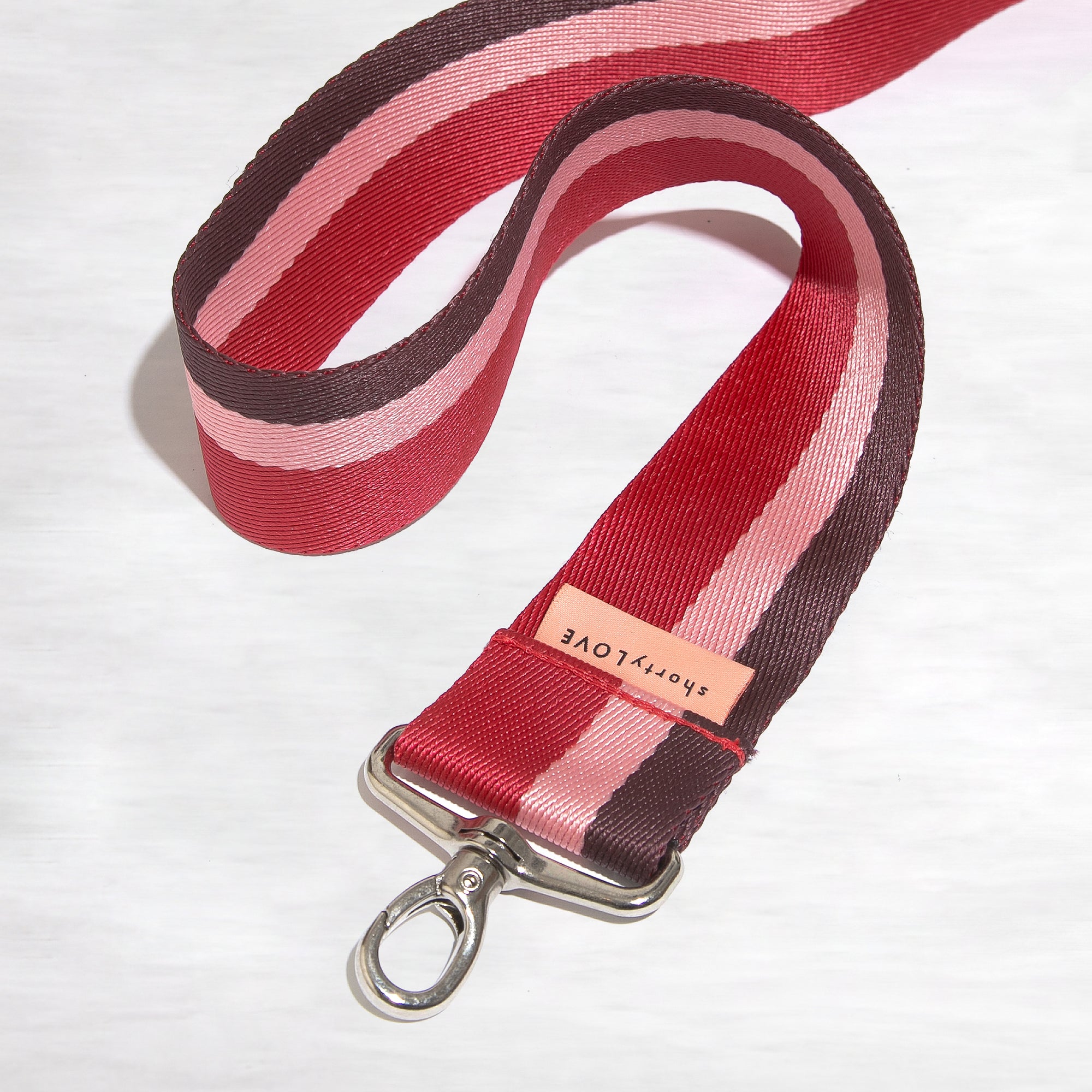 burgundy pink red strap on white background