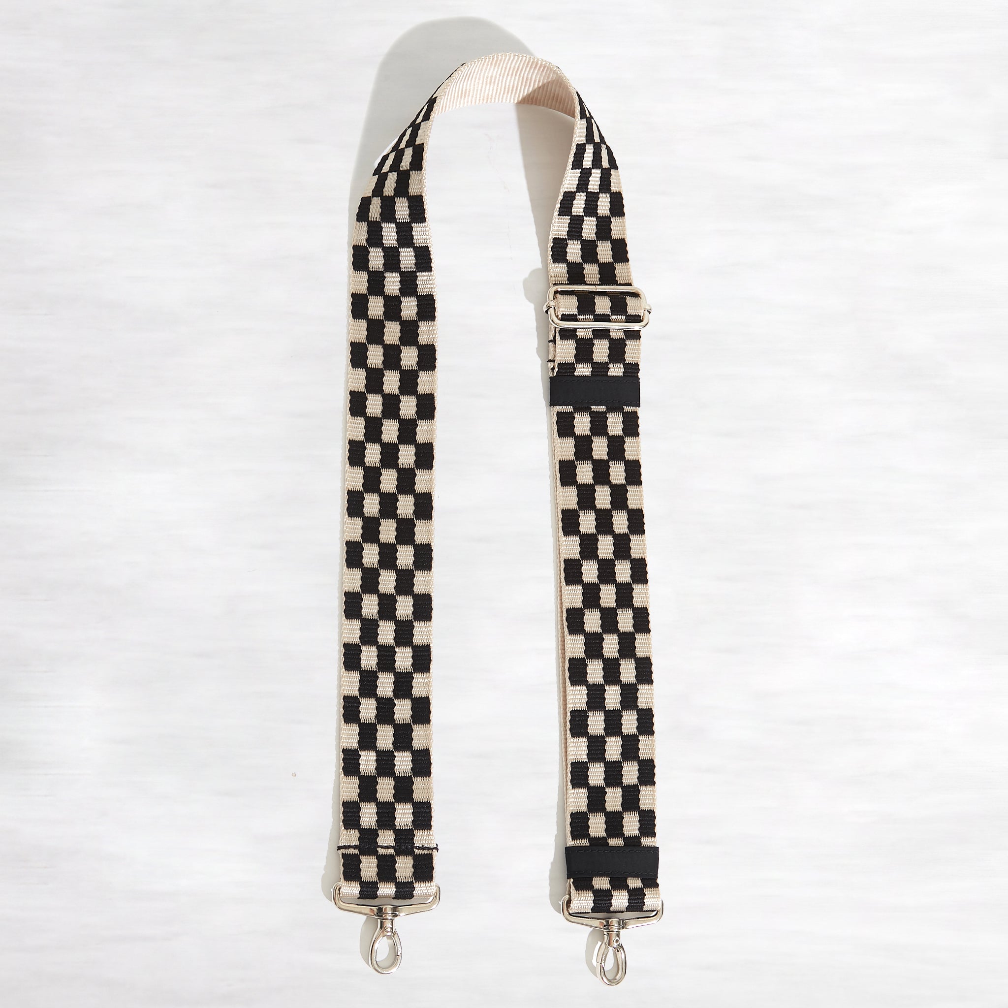 shortyLOVE boardwalk strap in black/white checker; top view open against white background.