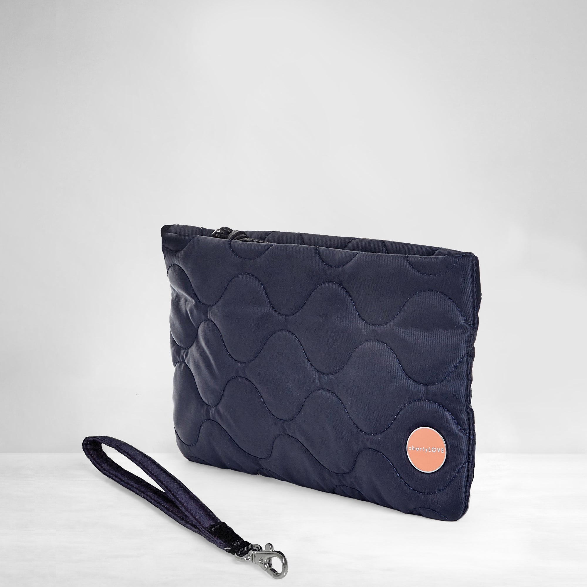 shortyLOVE cleo wristlet clutch in midnight; side view against white background.