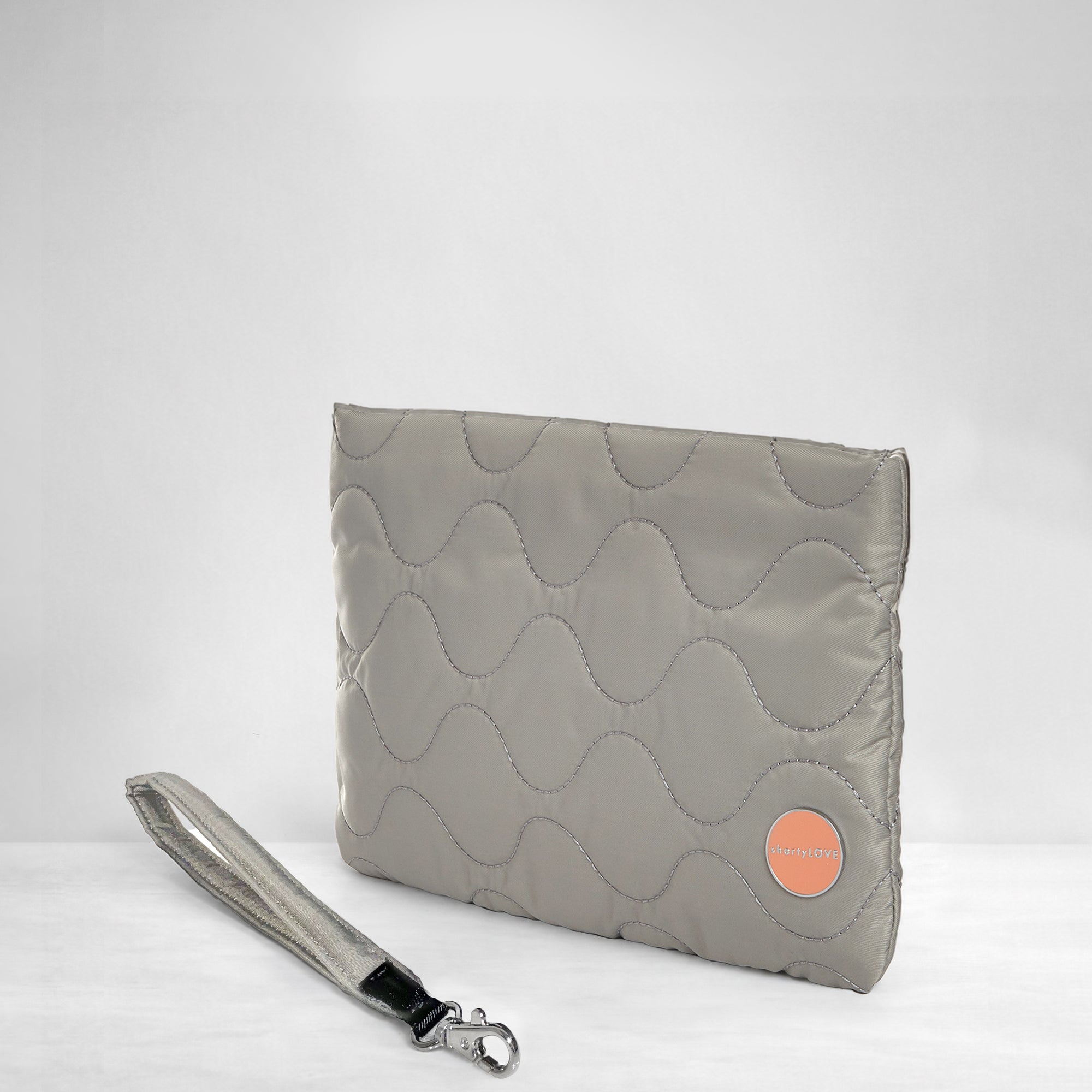 shortyLOVE cleo wristlet clutch in milky grey; side view against white background.