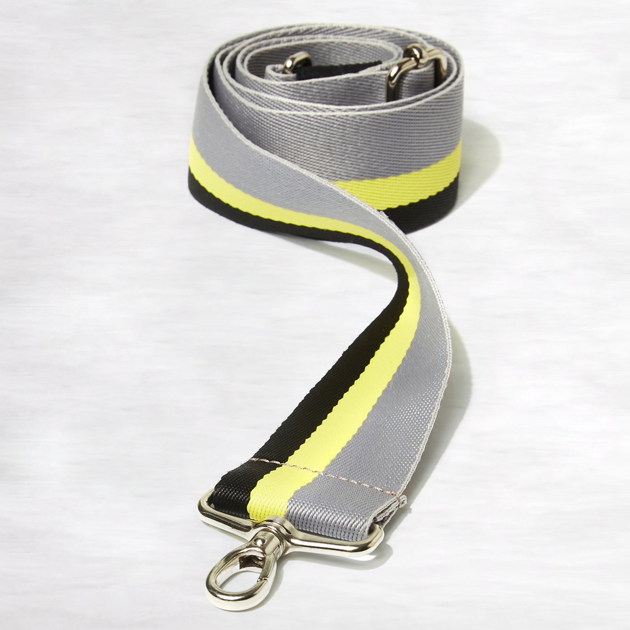 shortyLOVE boardwalk strap in grey/yellow/black; coiled close up view against white background.