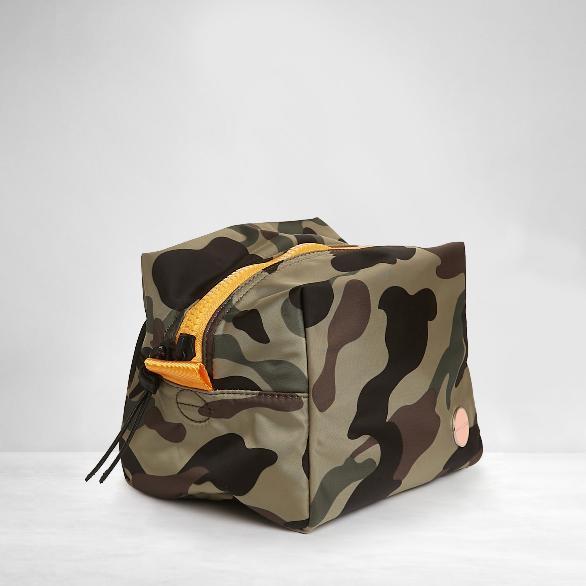 shortyLOVE stevie cosmetic bag in green camo; side angle view against white background.