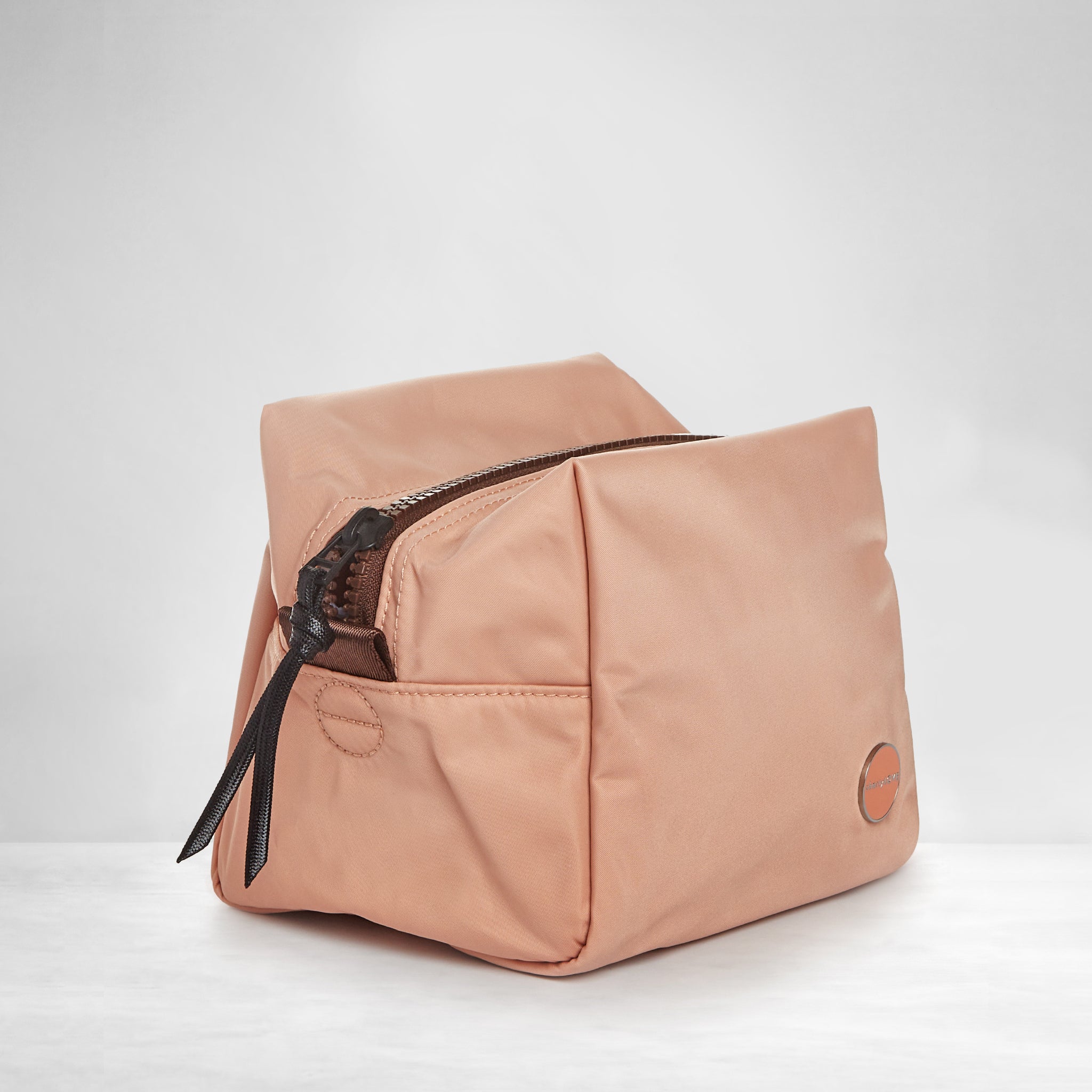 shortyLOVE stevie cosmetic bag in dusty peach; side angle view against white background.