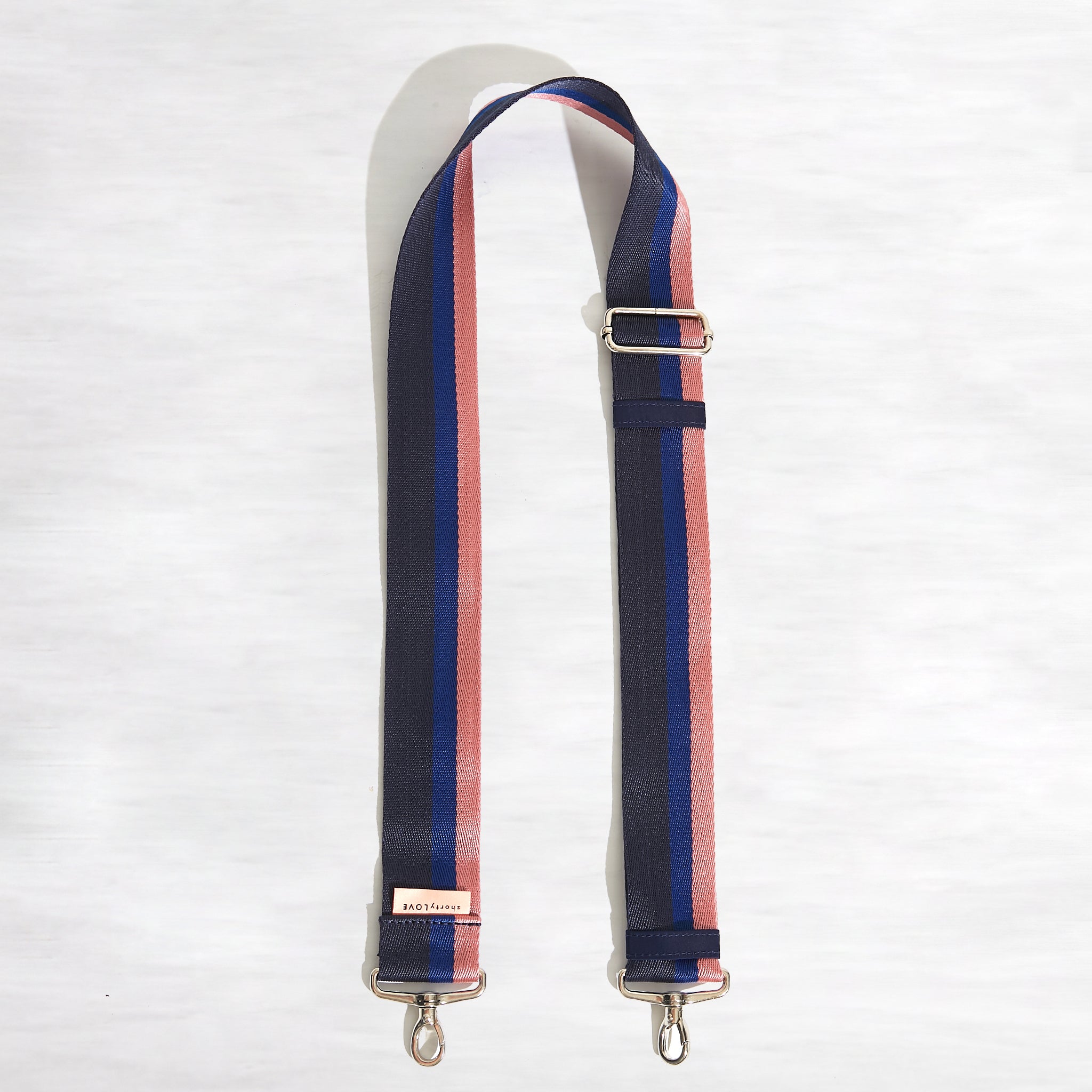 shortyLOVE boardwalk strap in navy/blue/pink; top view open against white background.
