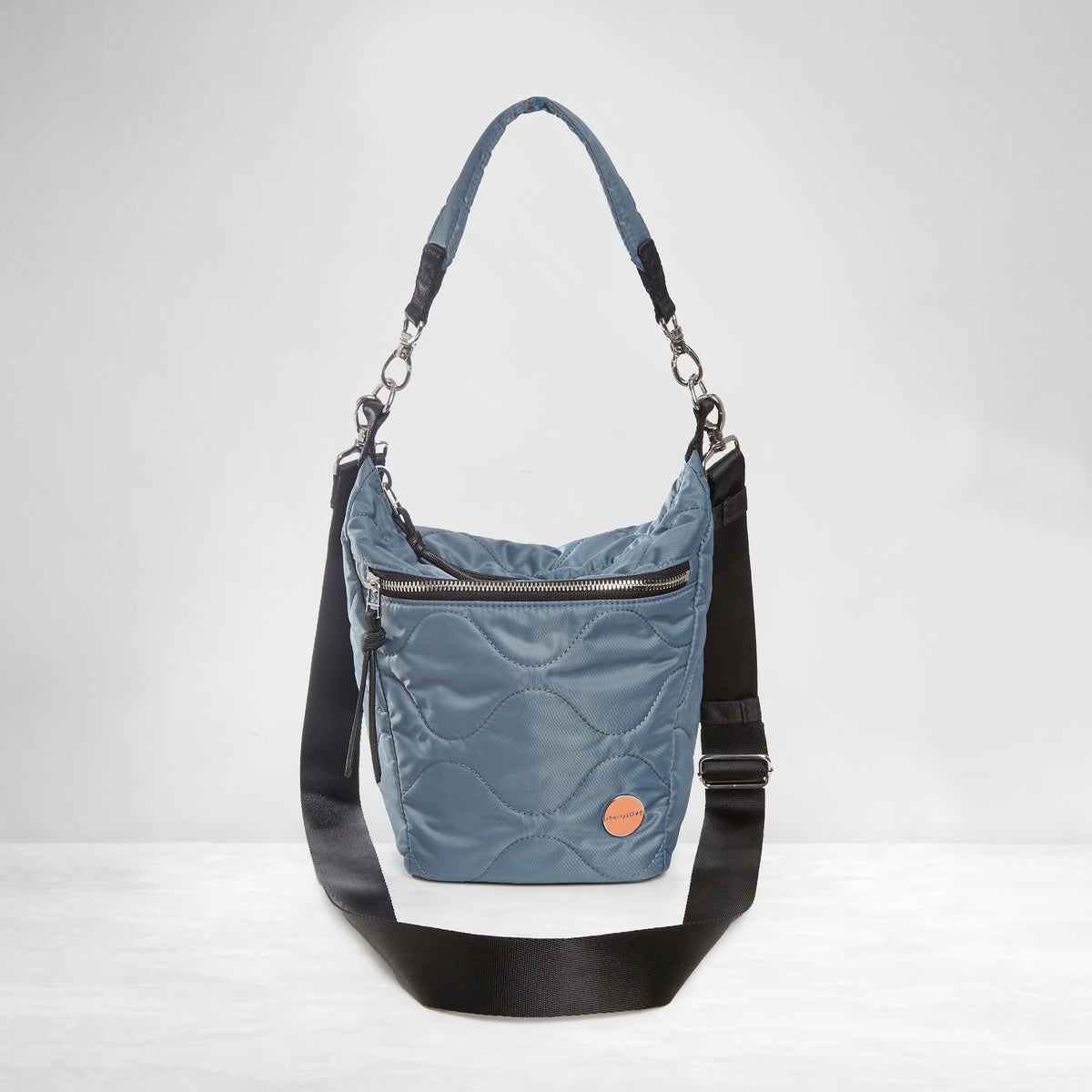 shortyLOVE marcel crossbody bucket bag in steel blue; front view against white background.