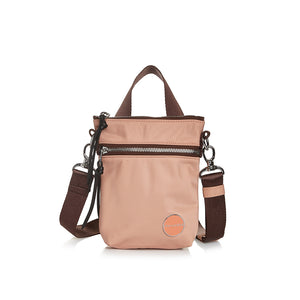shortyLOVE shorthand small crossbody bag in dusty peach; front view against white background.