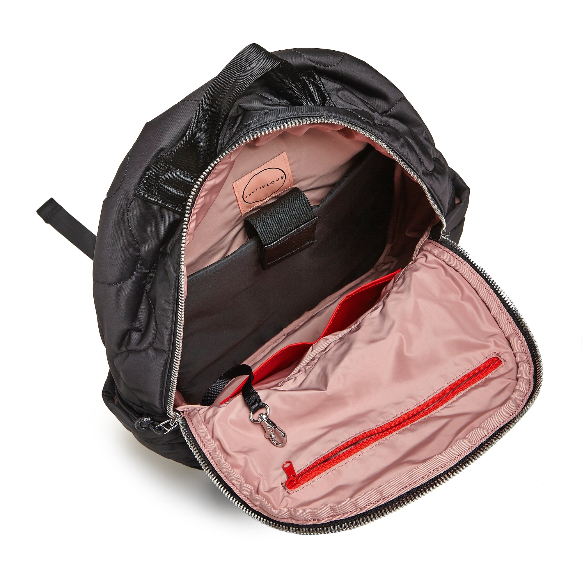 shortyLOVE tate backpack in black; top-down view showing interior blush lining against white background.