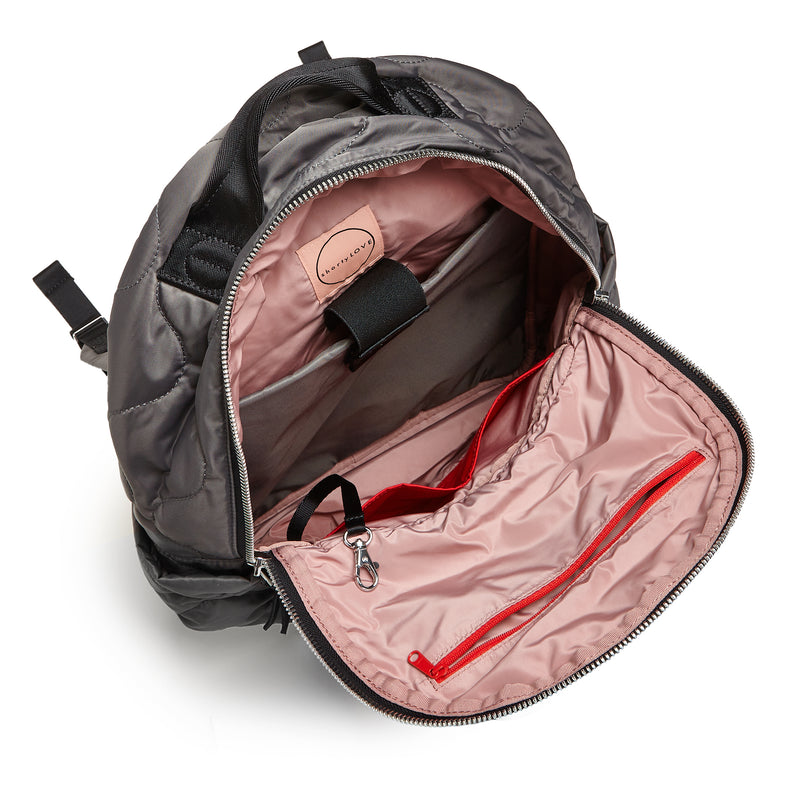 shortyLOVE tate backpack in pewter; top-down view showing interior blush lining against white background.