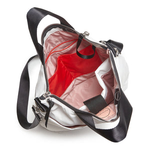 shortyLOVE wonder large crossbody/messenger bag in white; top-down view showing interior blush/red lining against white background.