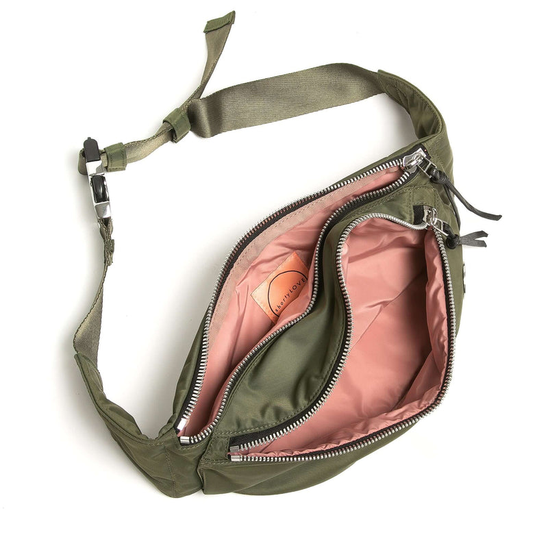 shortyLOVE arcade belt bag in army green; top-down view showing interior pink lining against white background.
