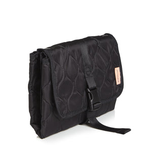 Black quilted diaper changing mat folded and closed - side view on a white background