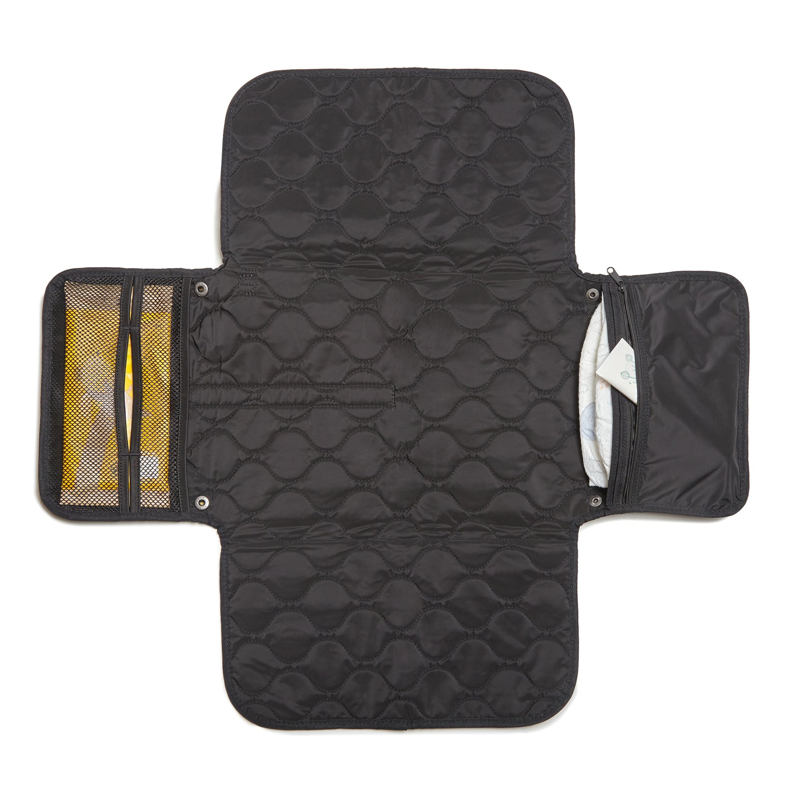 Black quilted diaper changing mat with multiple compartments on a white background