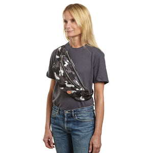 shortyLOVE arcade belt bag in grey camo; on model worn crossbody in grey t-shirt and jeans against white background.