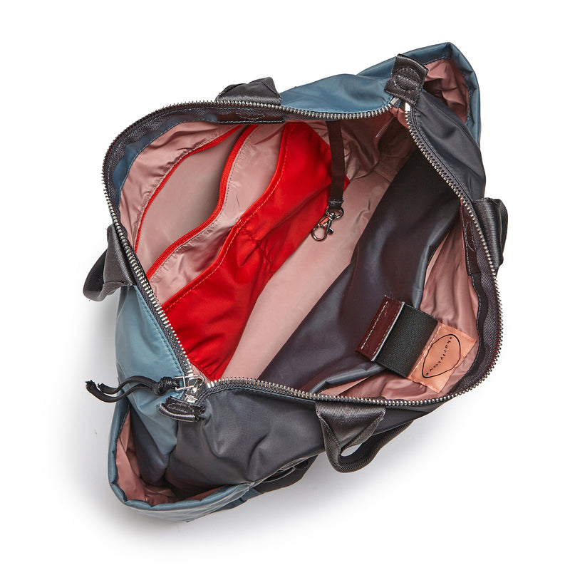 shortyLOVE tillie tote bag in steel blue/charcoal; top-down view showing interior steel blue/charcoal lining against white background.