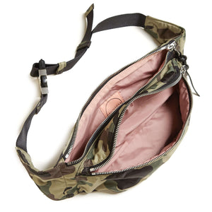 shortyLOVE arcade belt bag in green camo; top-down view showing interior pink lining against white background.