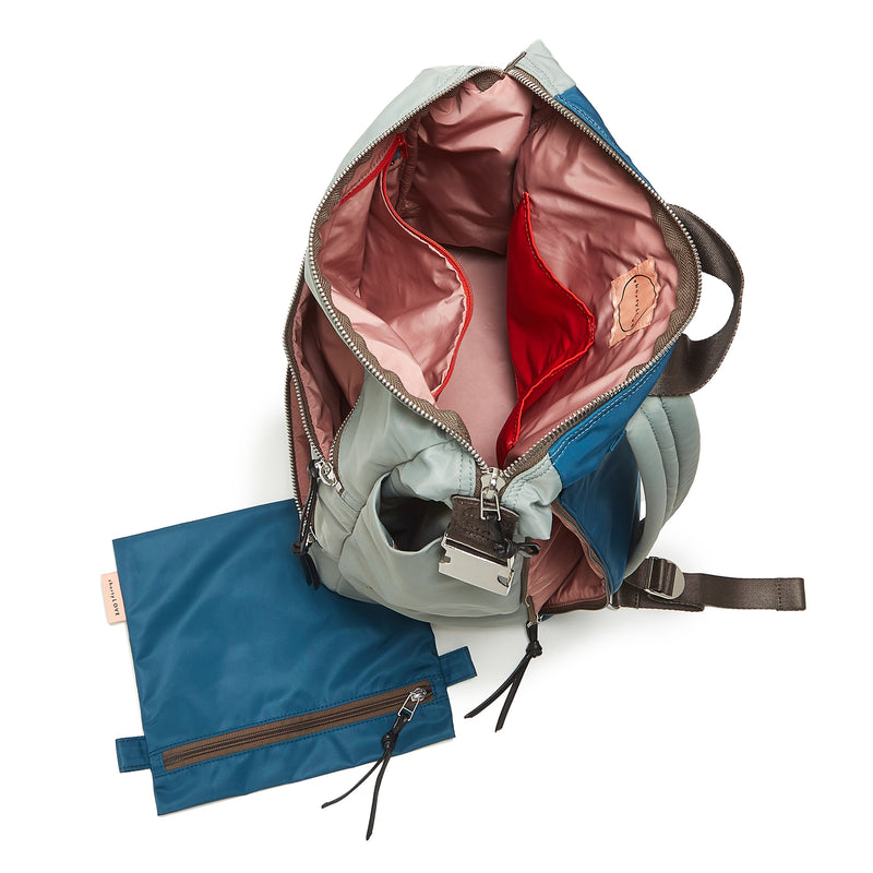 shortyLOVE boxer backpack in slate/teal; top-down view showing interior pink lining against white background.