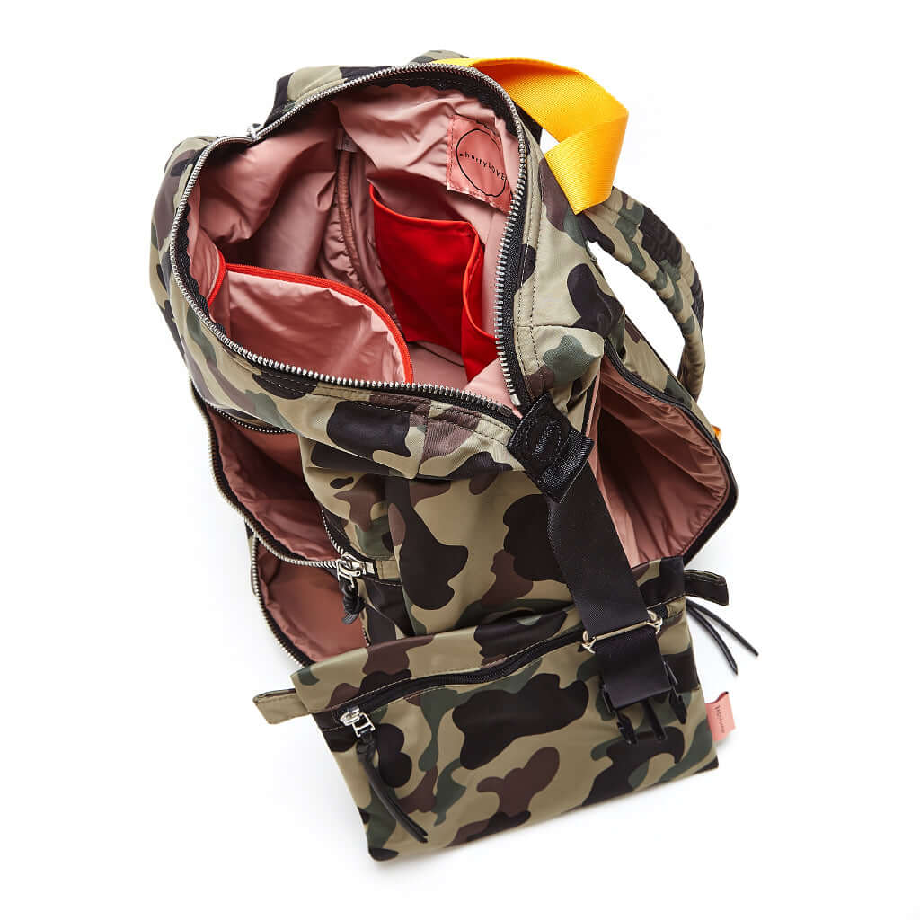 shortyLOVE boxer backpack bag in green camo; top-down view showing interior pink lining against white background.
