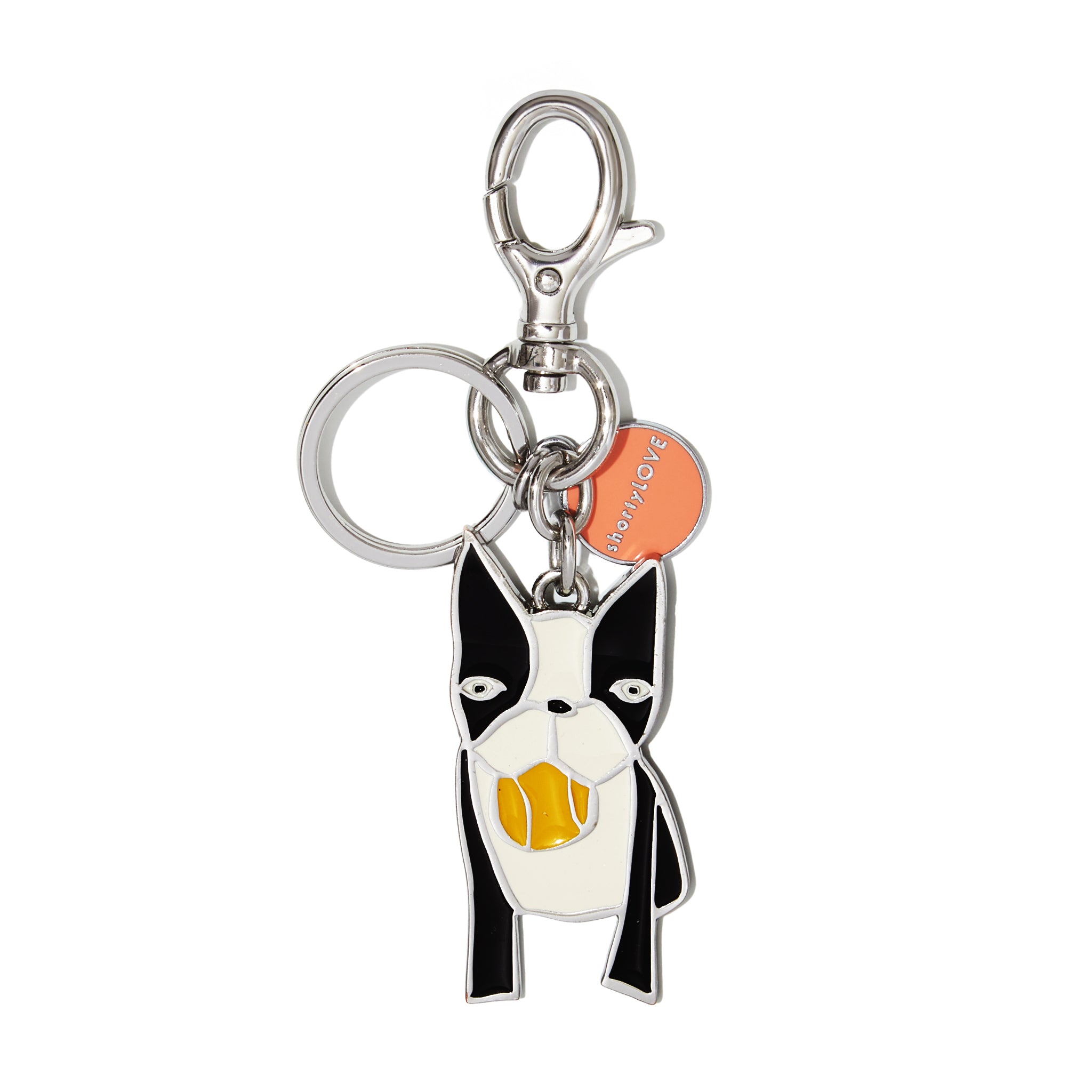 Keychain with dog design and visible brand tag on a white background