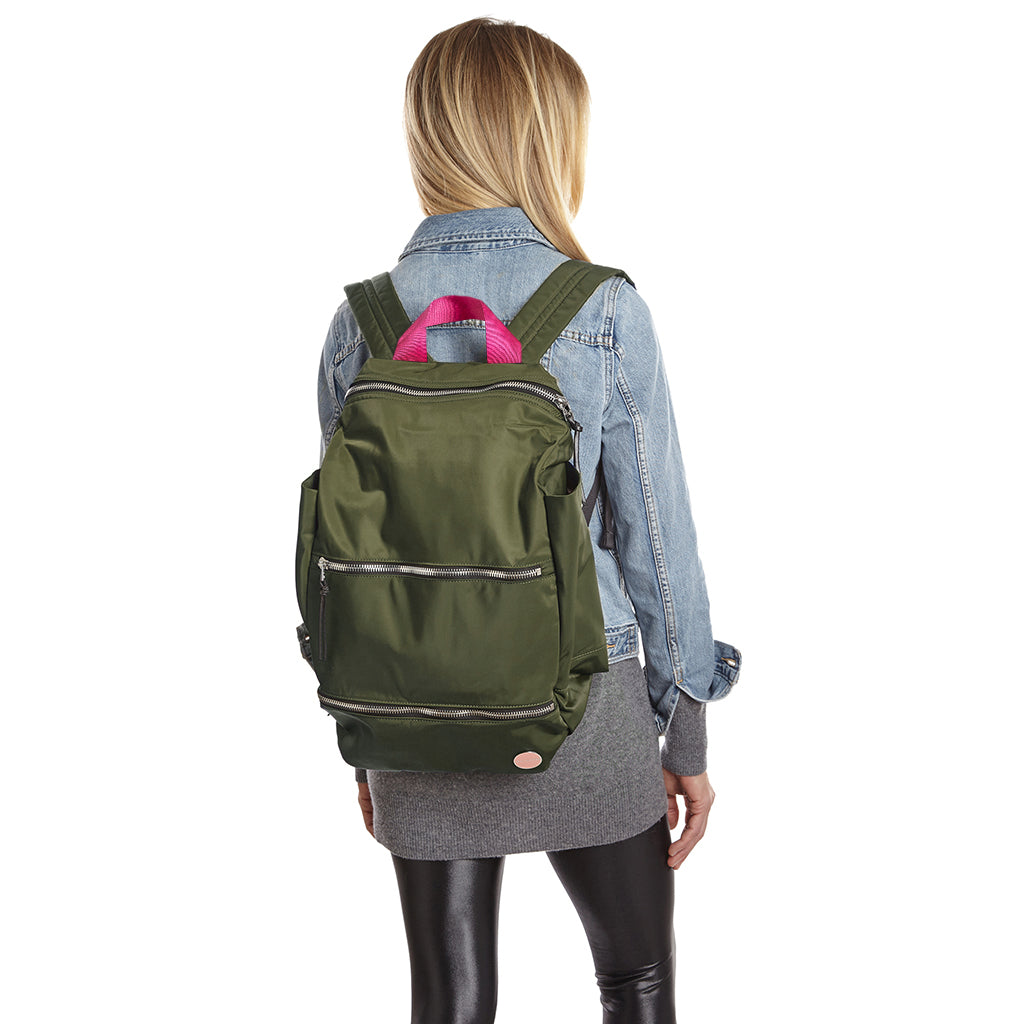 shortyLOVE boxer backpack bag in army green; on model in blue jean jacket and black leggings against white background.