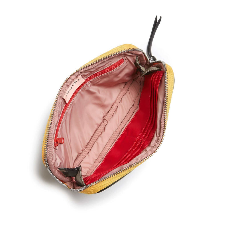 shortyLOVE jetty clutch/wallet in green camo; top-down view showing interior pink lining against white background.