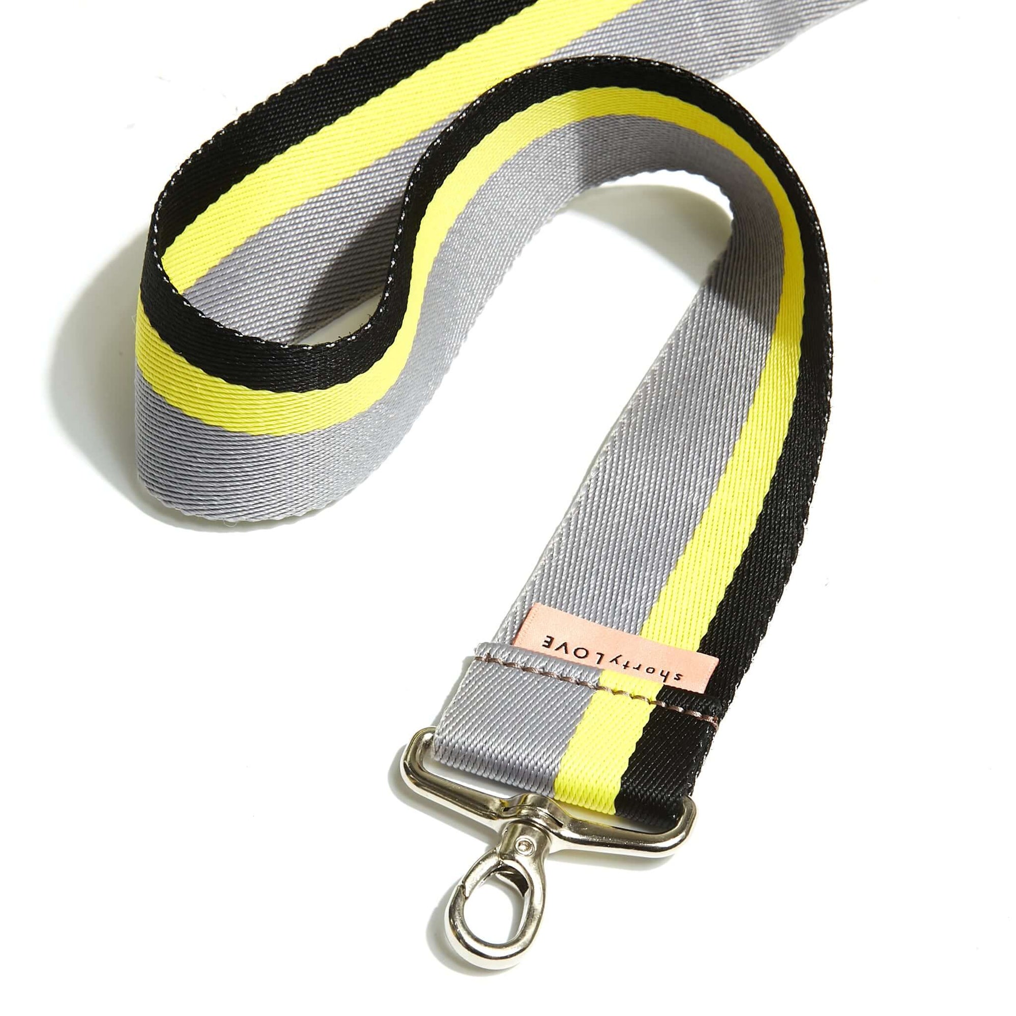 shortyLOVE boardwalk strap in grey/yellow/black; close up view against white background.