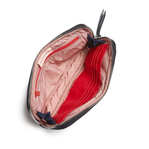 shortyLOVE jetty clutch/wallet in navy; top-down view showing interior pink lining against white background.