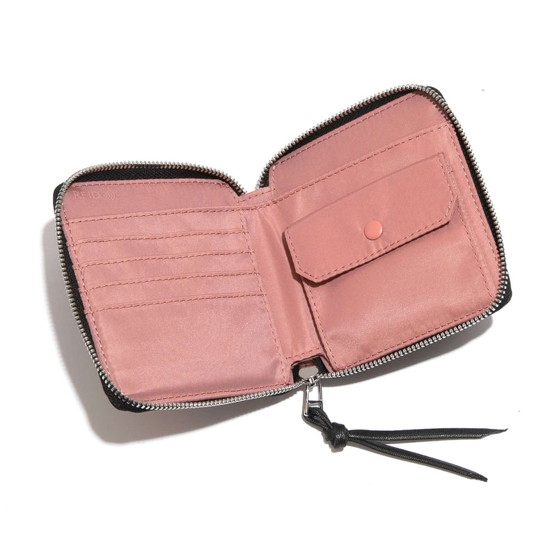 shortyLOVE merchant small wallet in navy; top-down view showing interior pink lining against white background.