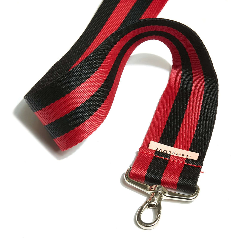 shortyLOVE boardwalk strap in red/black; close up view against white background.