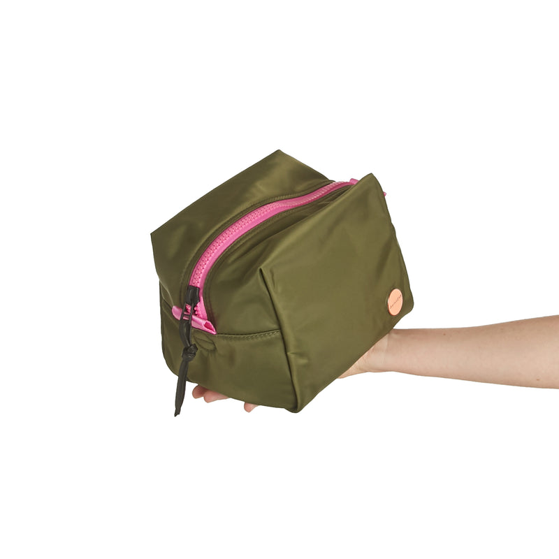 shortyLOVE stevie cosmetic bag in army green; hand held by model.