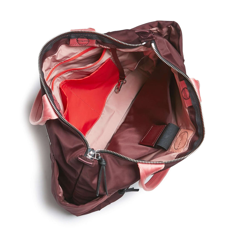 shortyLOVE tillie tote bag in burgundy; top-down view showing interior pink lining against white background.