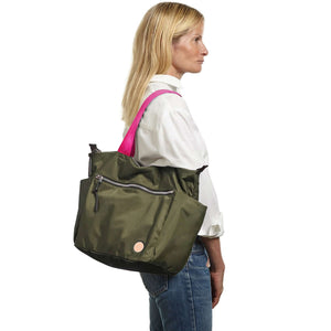 shortyLOVE tillie tote bag in army green; on model in white button down shirt and jeans against white background.