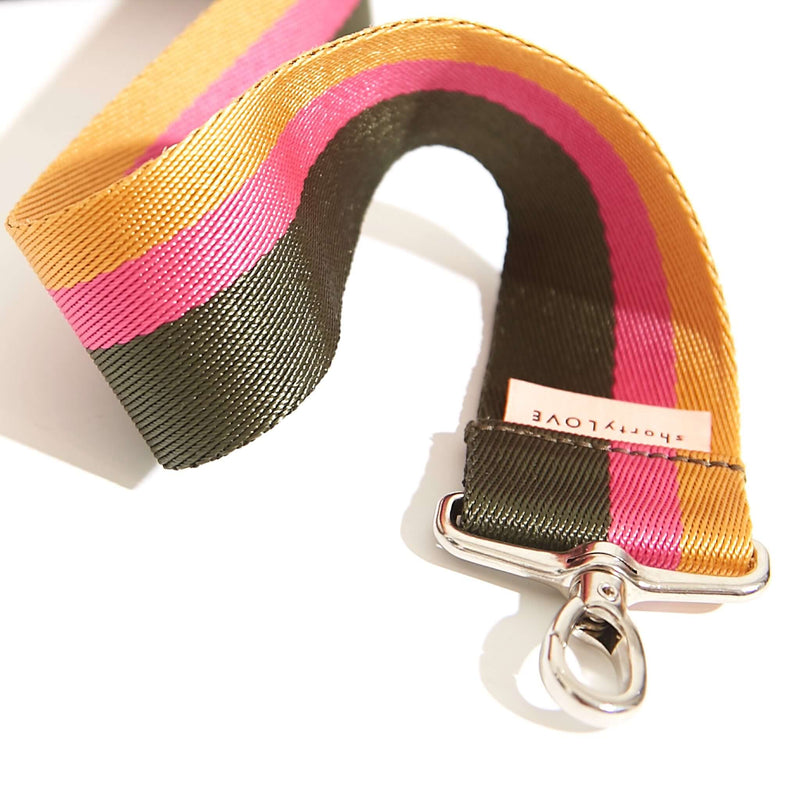 shortyLOVE boardwalk strap in green/yellow/fuchsia; close up view against white background.