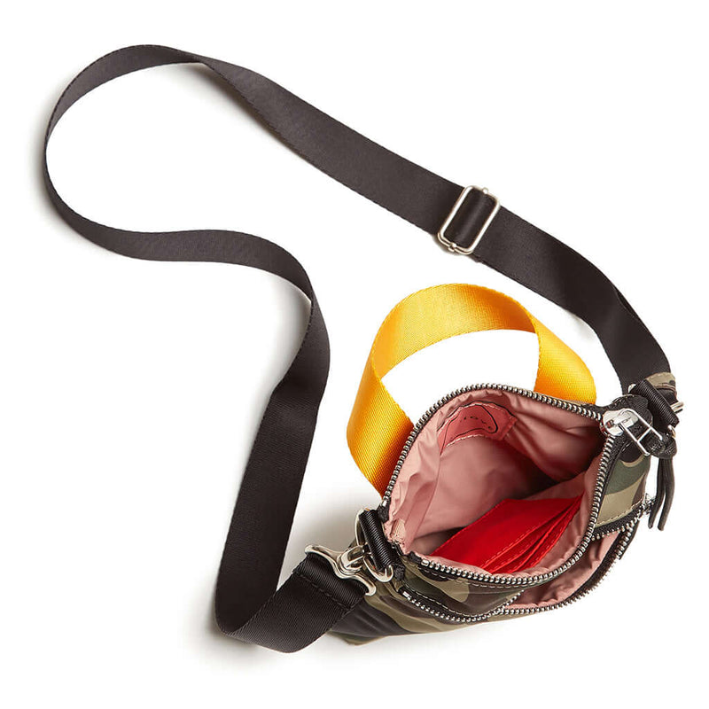 shortyLOVE shorthand crossbody phone bag in green camo; top-down view showing interior pink lining against white background